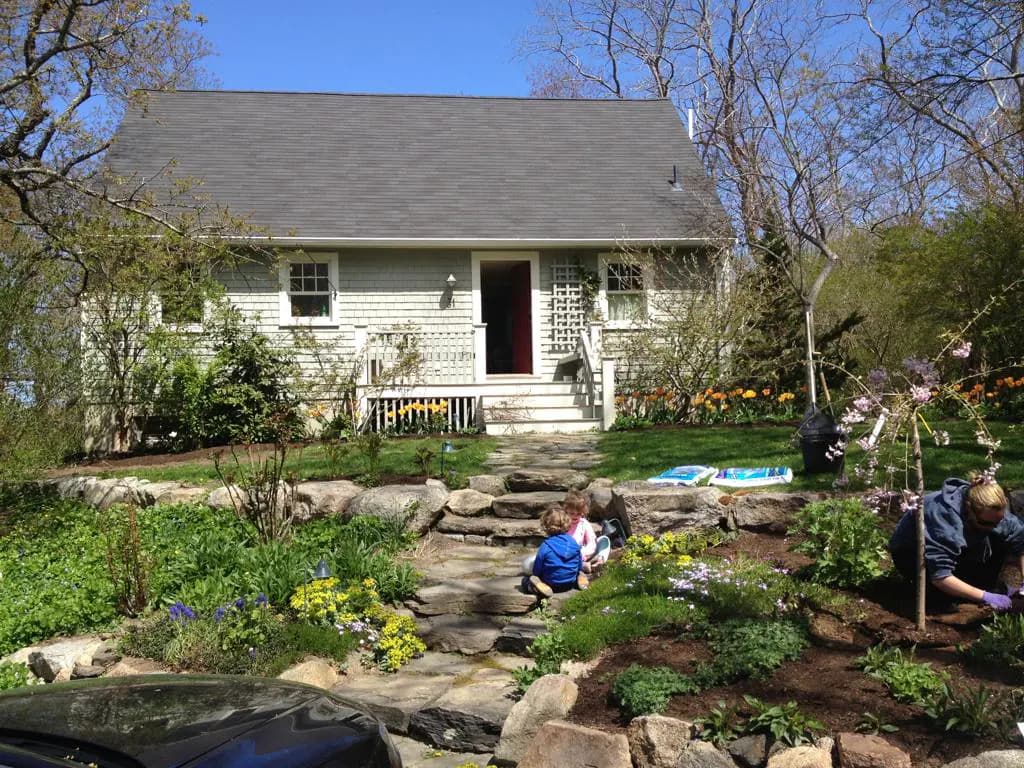 The cottage and its deck looking out toward the bay